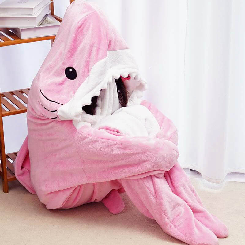 Pink Wearable Shark Blanket CozyShark wearable shark blanket Person enjoying CozyShark brand shark blanket Comfortable CozyShark shark blanket Unique CozyShark wearable blanket CozyShark shark blanket for cozy nights Fashionable shark-themed CozyShark blanket CozyShark blanket for kids and adults Warm and snuggly CozyShark shark blanket Fun CozyShark wearable blanket CozyShark brand shark blanket for lounging